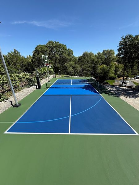 Two-Tone Blue Multi-Sport Court with Green Surround, Basketball and Pickleball by Precision Pro Courts