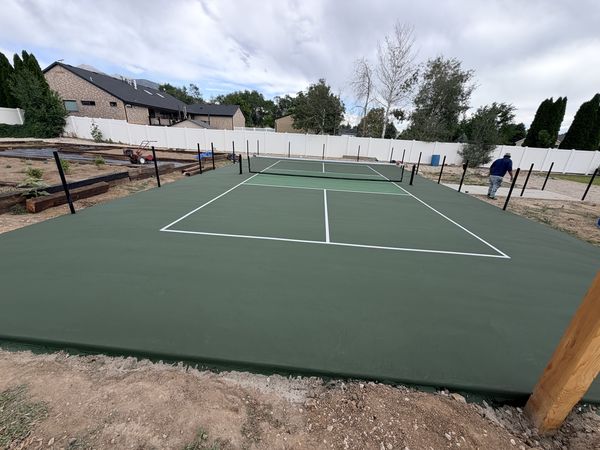 Green Backyard Tennis and Pickleball Court with White Vinyl Fence by Precision Pro Courts in Utah