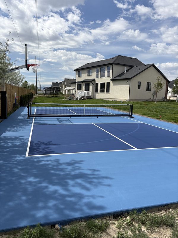 Two-Tone Blue Backyard Multi-Sport Court with Pickleball, Tennis and Basketball by Precision Pro Courts
